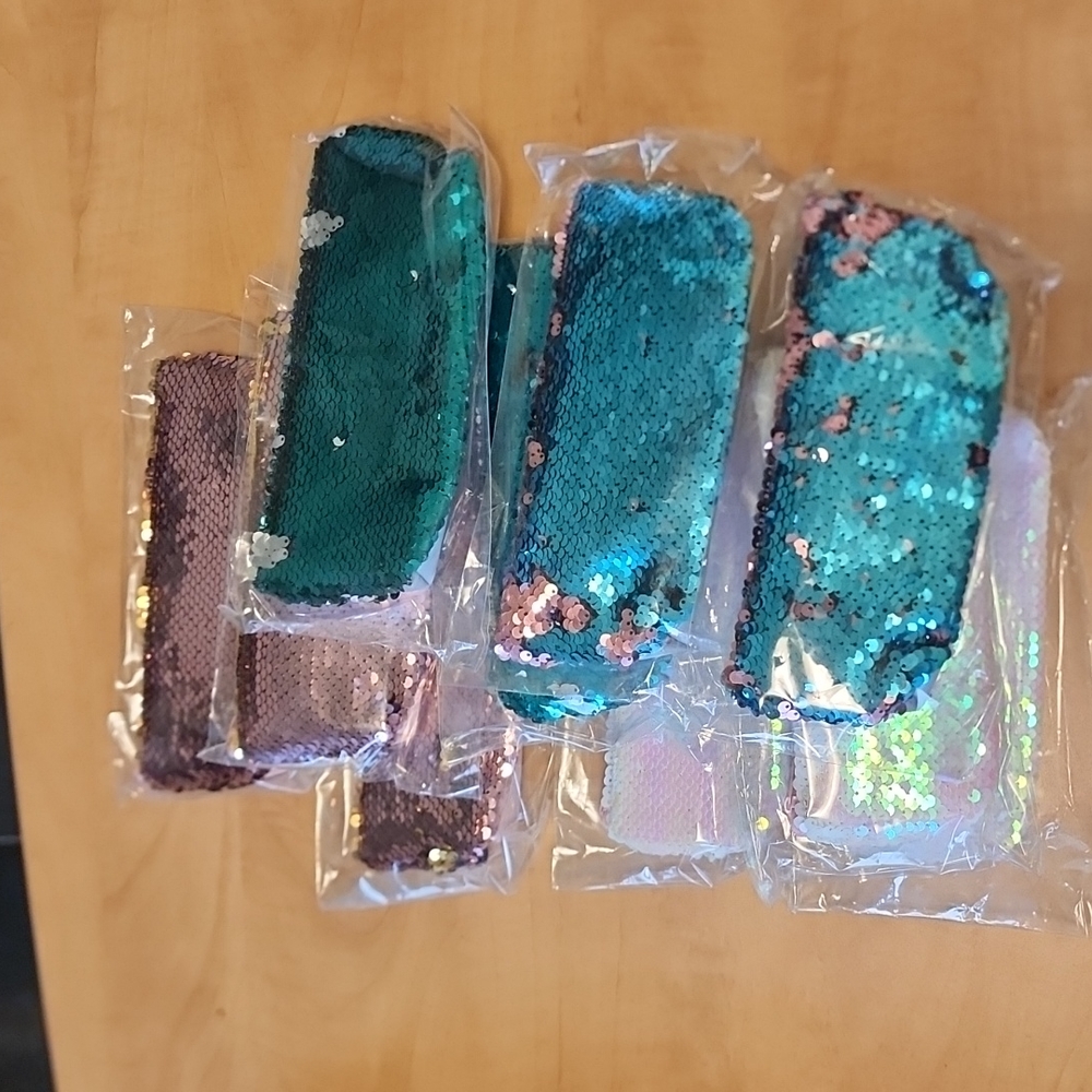 Lot of ten sequin pencil cases party favours